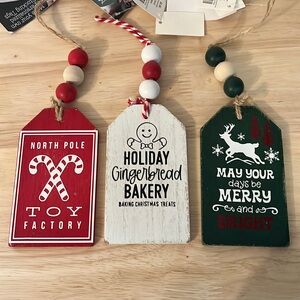 Set of three Christmas stocking tags with beaded hangers